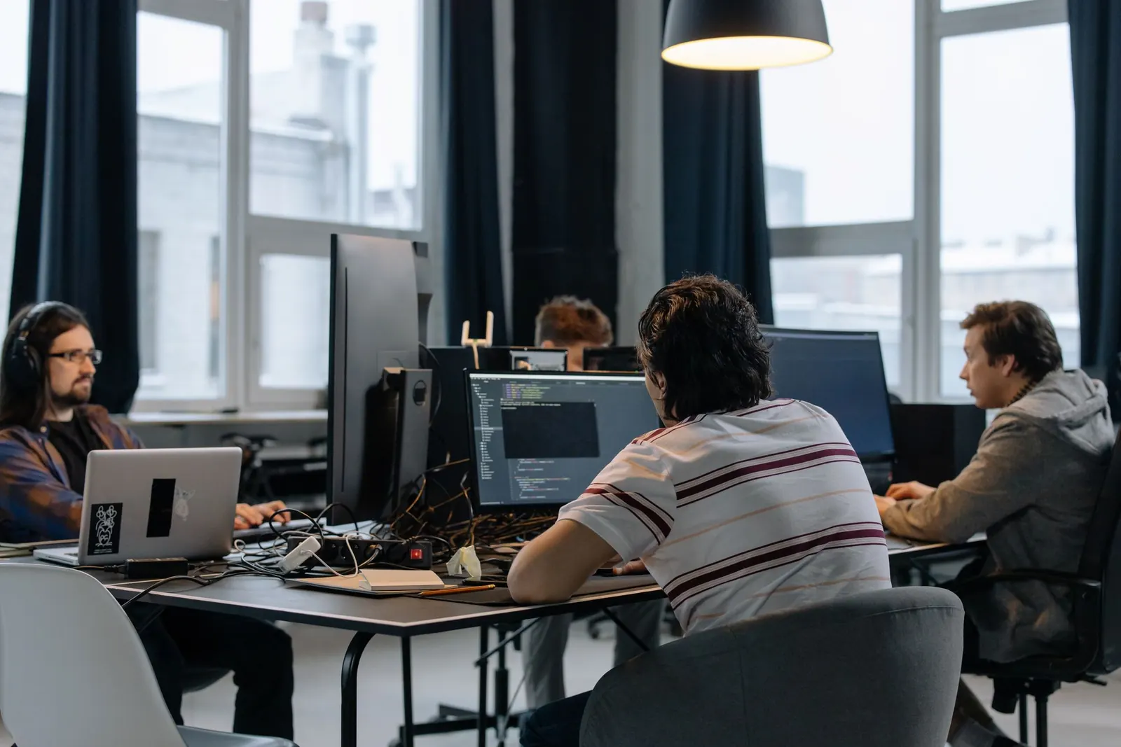 Developers working at their desks in a shared office